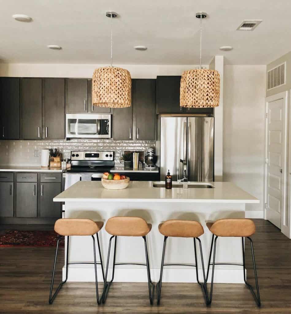 Modern Kitchen With White Countertop and Black Cabinets