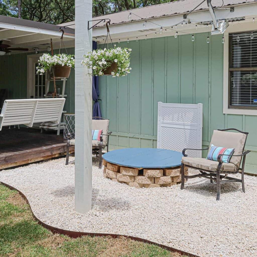 Patio With White Flowers in Hanging Planters