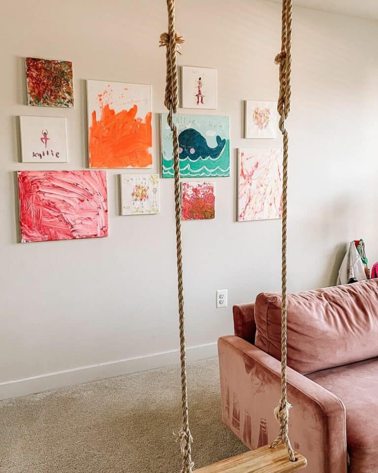 Rope Swing Beside a Pink Playroom Sofa