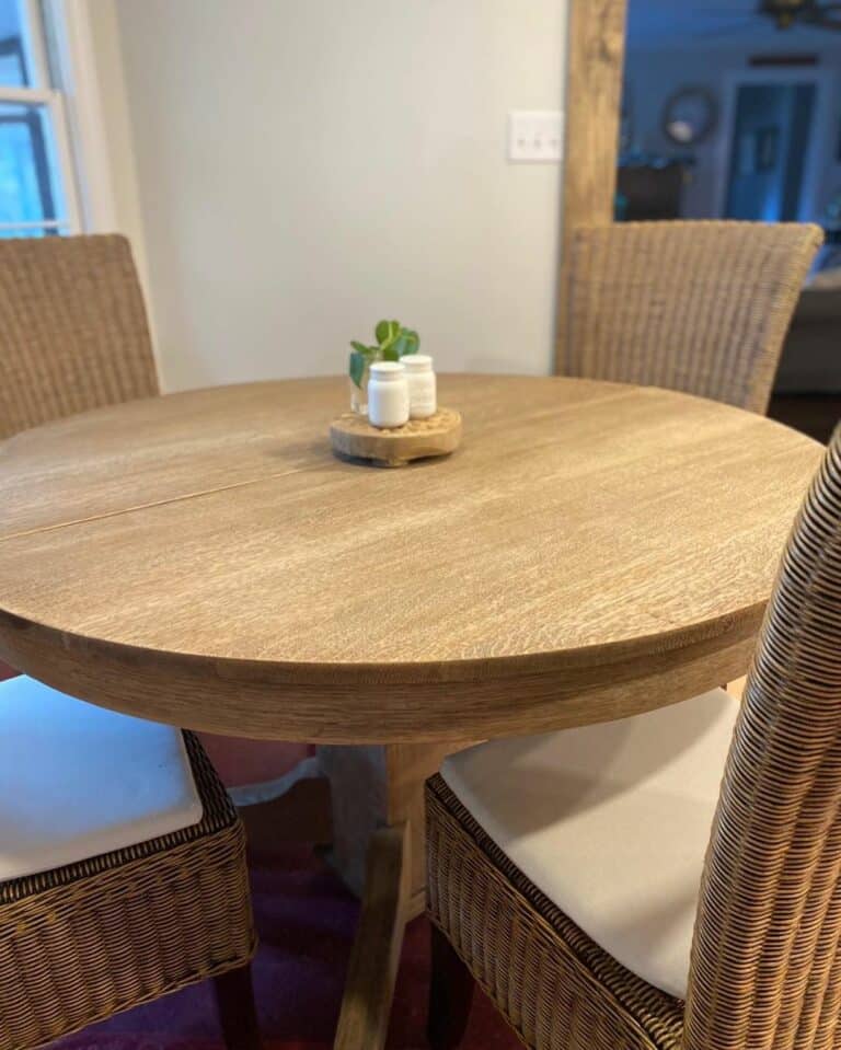 Round Light Wood Dining Table With Wicker Chairs