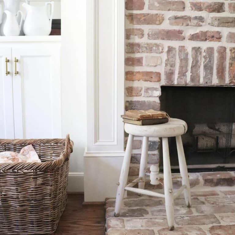 Round White Stool With Antique Book Stack