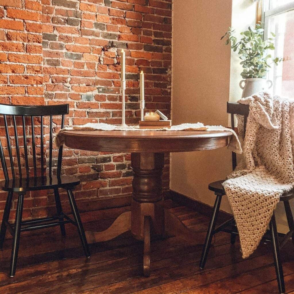 Rustic Breakfast Nook With a Brick Accent Wall