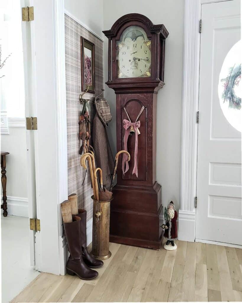 Rustic Wood Flooring and Antique Clock in Entryway
