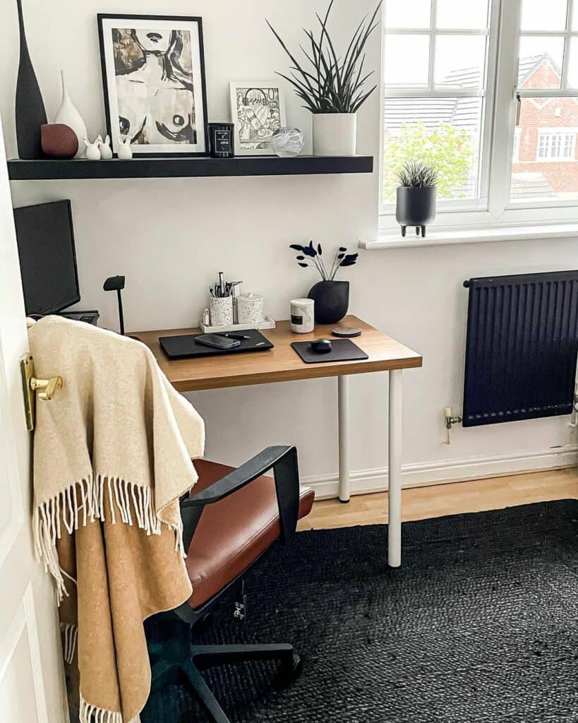 Simple Home Office With Black Floating Shelf Above Desk