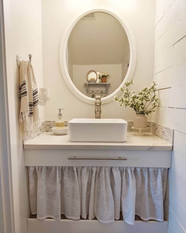 Small Cottage Guest Bath With White Sink Skirt