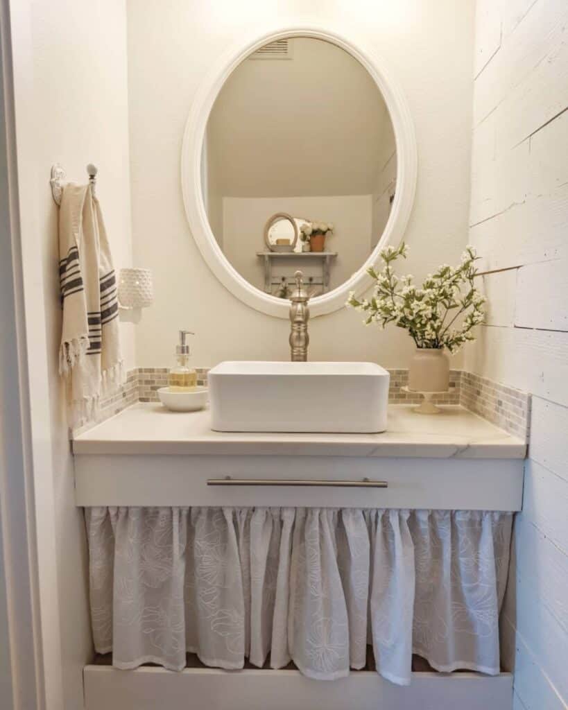 Small Cottage Guest Bath With White Sink Skirt