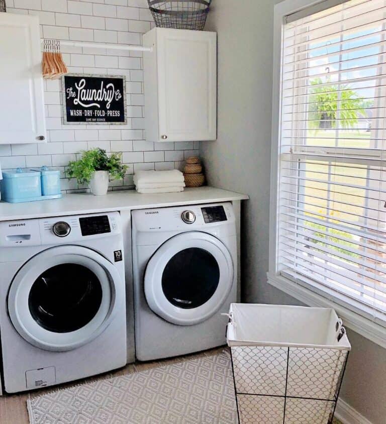 Small Laundry Room With White Drying Rod