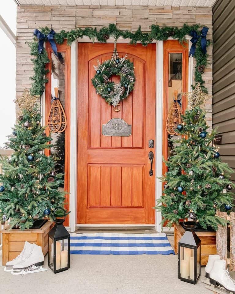 Stained Wood Front Door With Small Christmas Trees