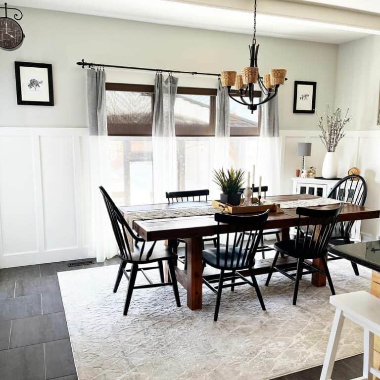 Sturdy Wooden Dining Table With Black Spindle Chairs