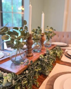 Tablescape With Greenery and Wood Candlesticks