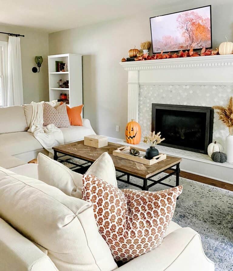 Tiled Fireplace Topped With Fall Ornaments