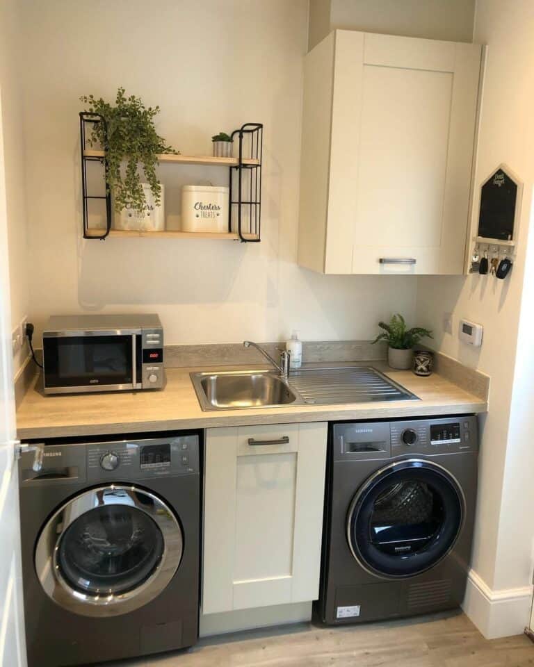 Utility Room With Gray Laundry Appliances
