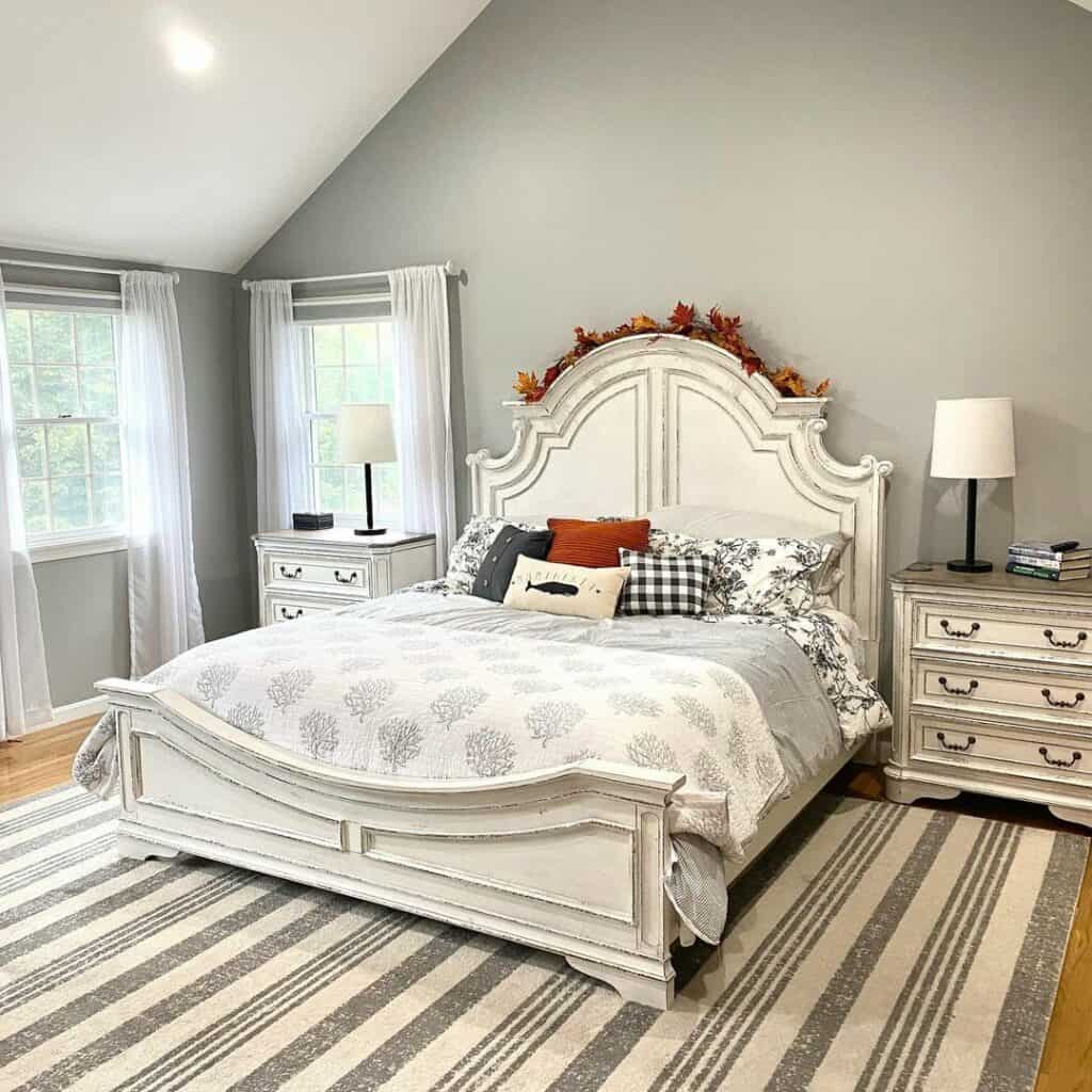 Vaulted Gray Bedroom With Rustic Wood Nightstands