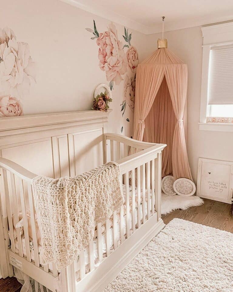 Vintage-inspired Pink Nursery With Floral Accent Wall