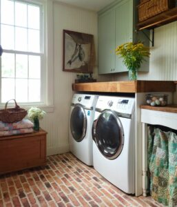 White Beadboard Laundry Room With Brick Floor