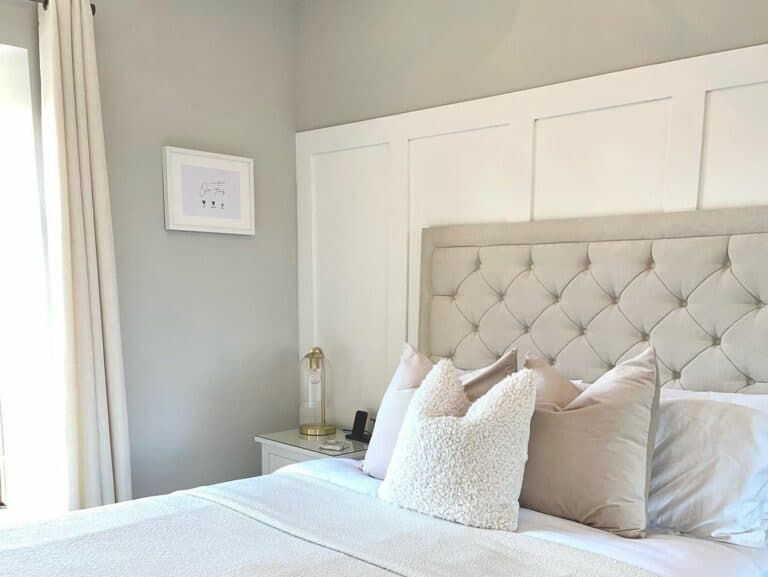 White Board and Batten Paneled Wall Behind Tufted Headboad