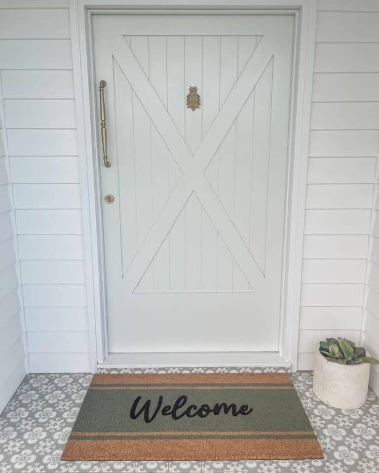 White Cottage Entryway With Gray Front Door
