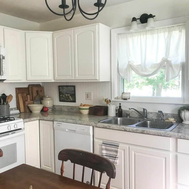 White Cottage House Kitchen With Gray Countertop