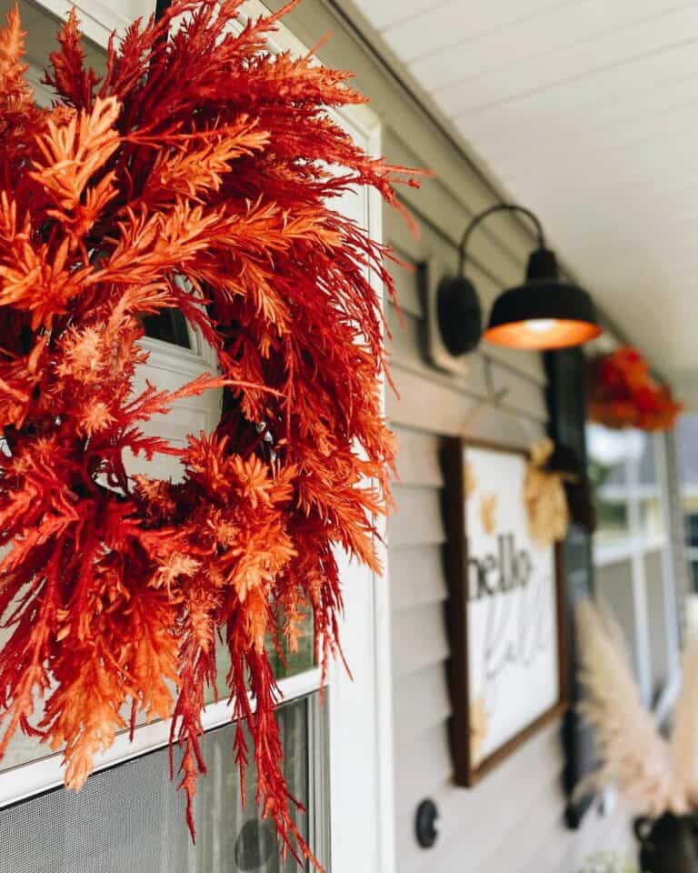 White Entrance Door With Orange Door Wreath