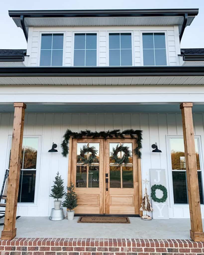 White Farmhouse Porch With Christmas Décor