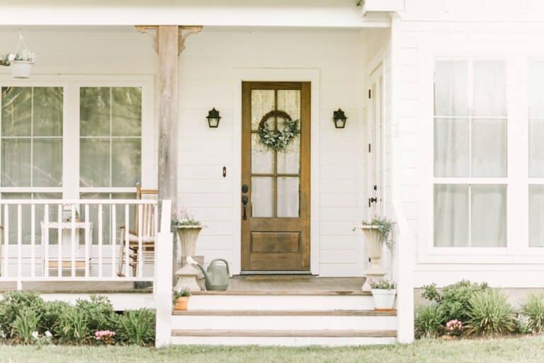 White Farmhouse Porch With Rocking Chair