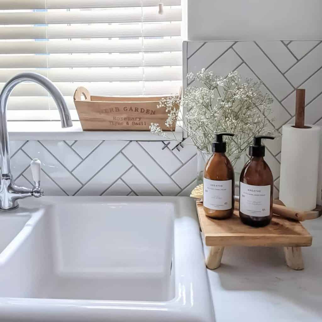 White Herringbone Tile Backsplash With Wood Décor