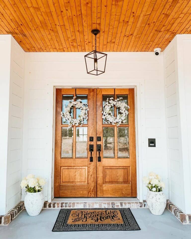 White Porch With Double Wooden Doors