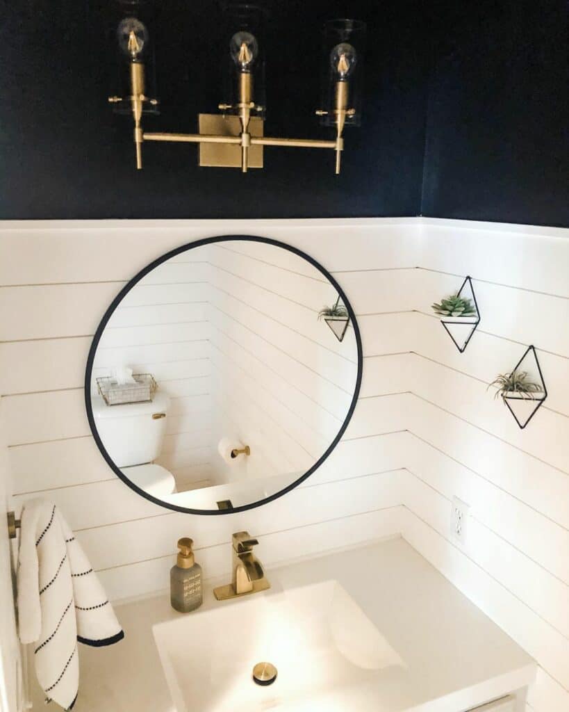 White Shiplap Hosts a Circular Mirror