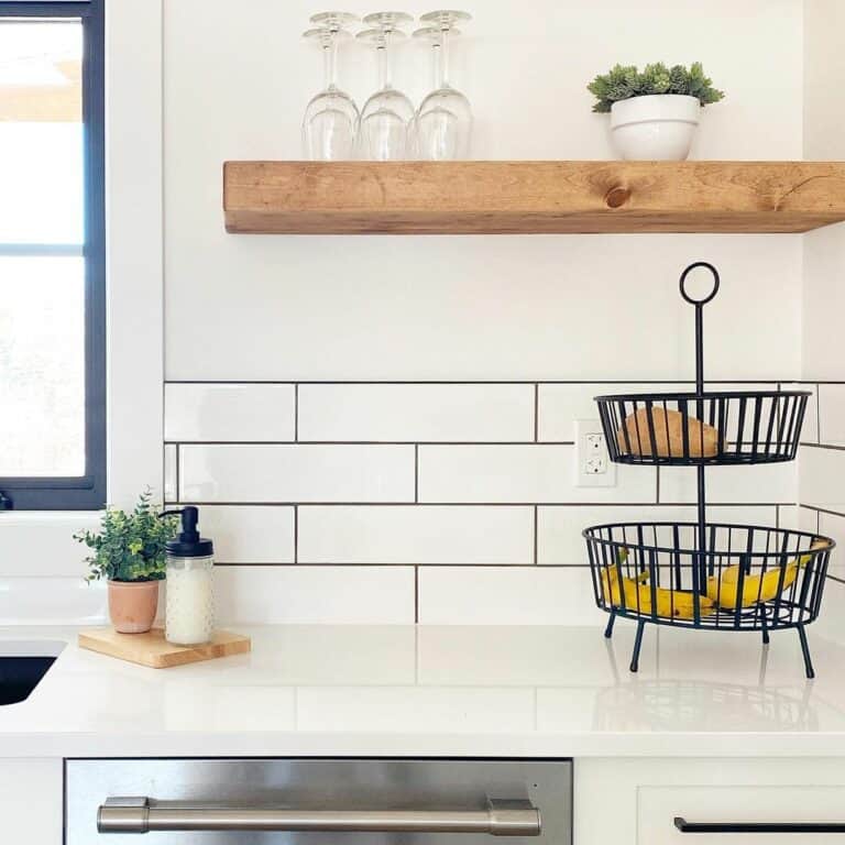 White Tile Kitchen Backsplash With Floating Wood Shelf