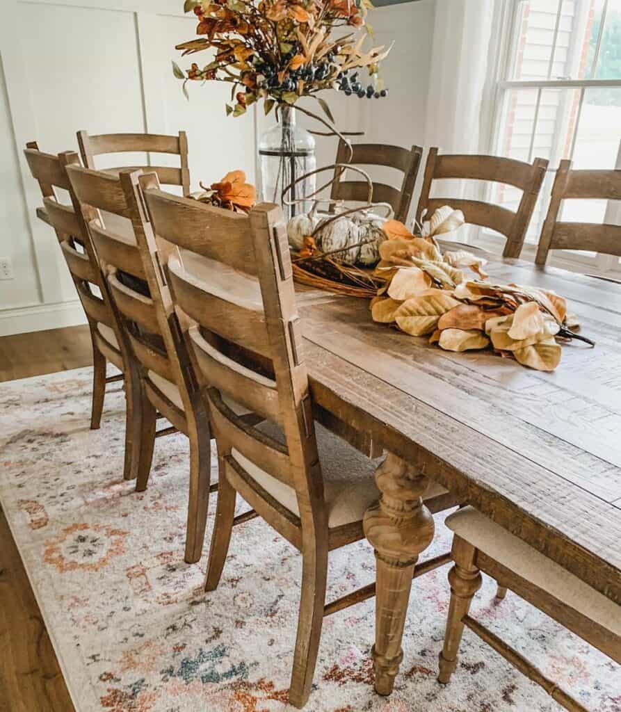 Wood Dining Table With Autumn Centerpiece