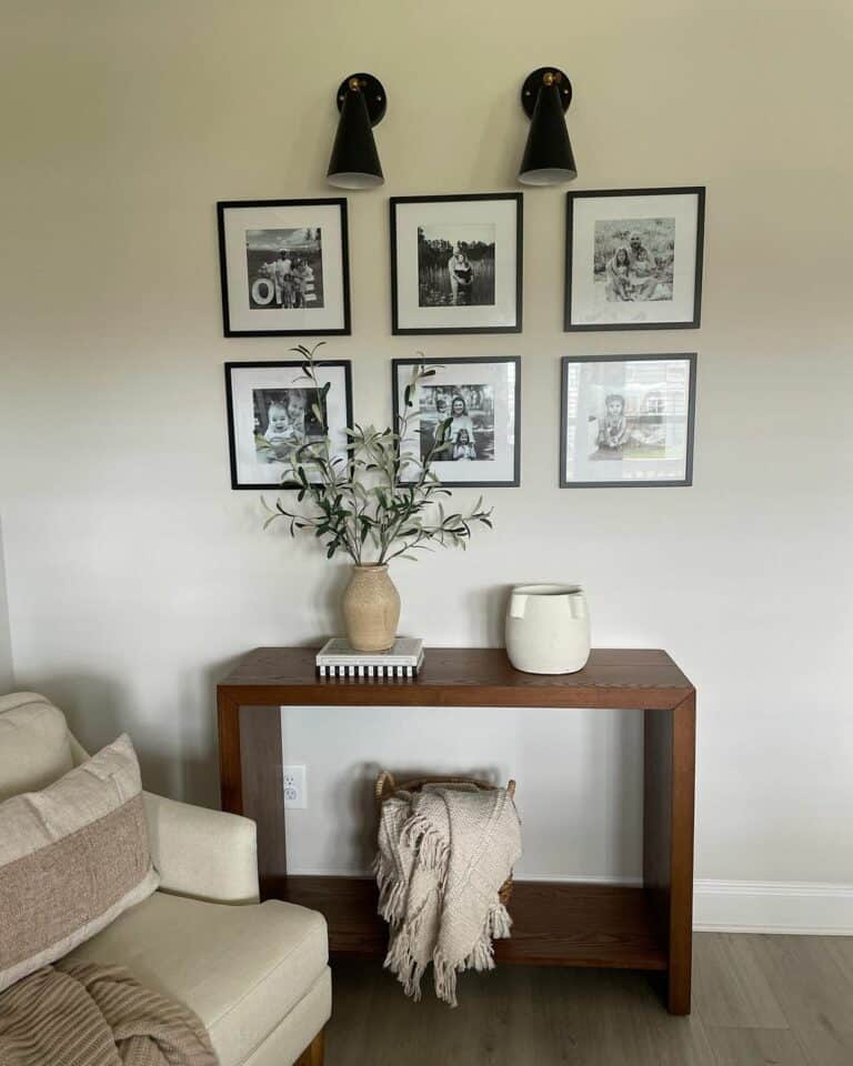 Wooden Console Table WIth Black and White Gallery Wall