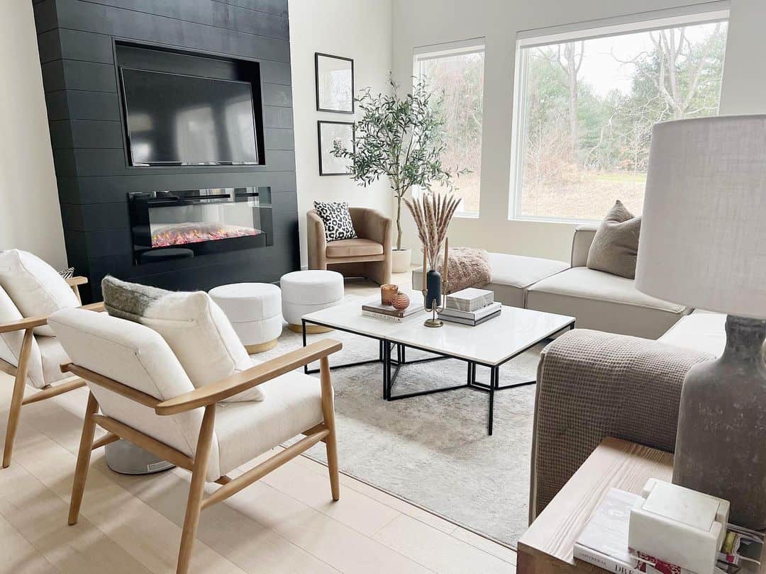 Airy and Bright Living Room With Black Fireplace - Soul & Lane