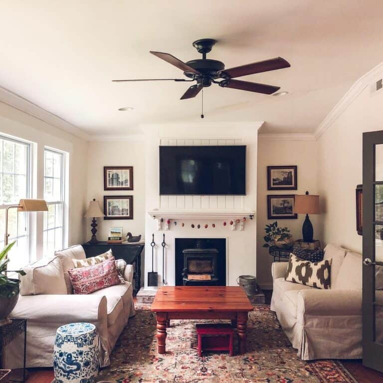 Antique Fireplace With Light Gray Sofas and Coffee Table