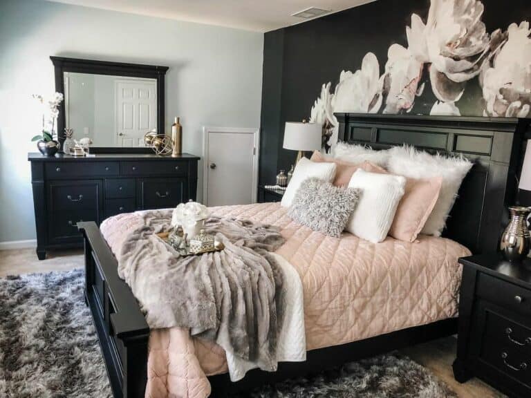 Black and Floral Wallpaper With Pink Mattress in Bedroom