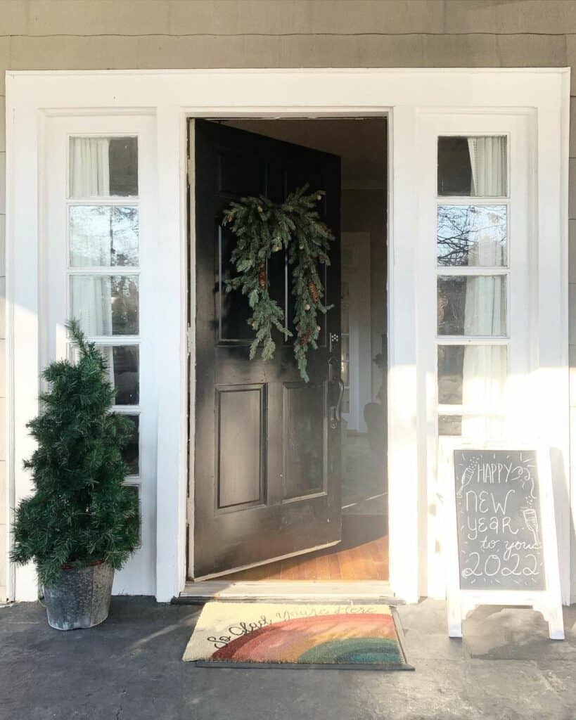 Black and White Entryway With Green Garland