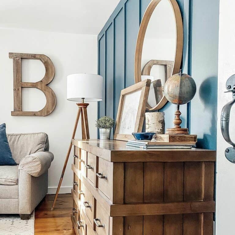 Blue Wall Hosts a Wooden Dresser