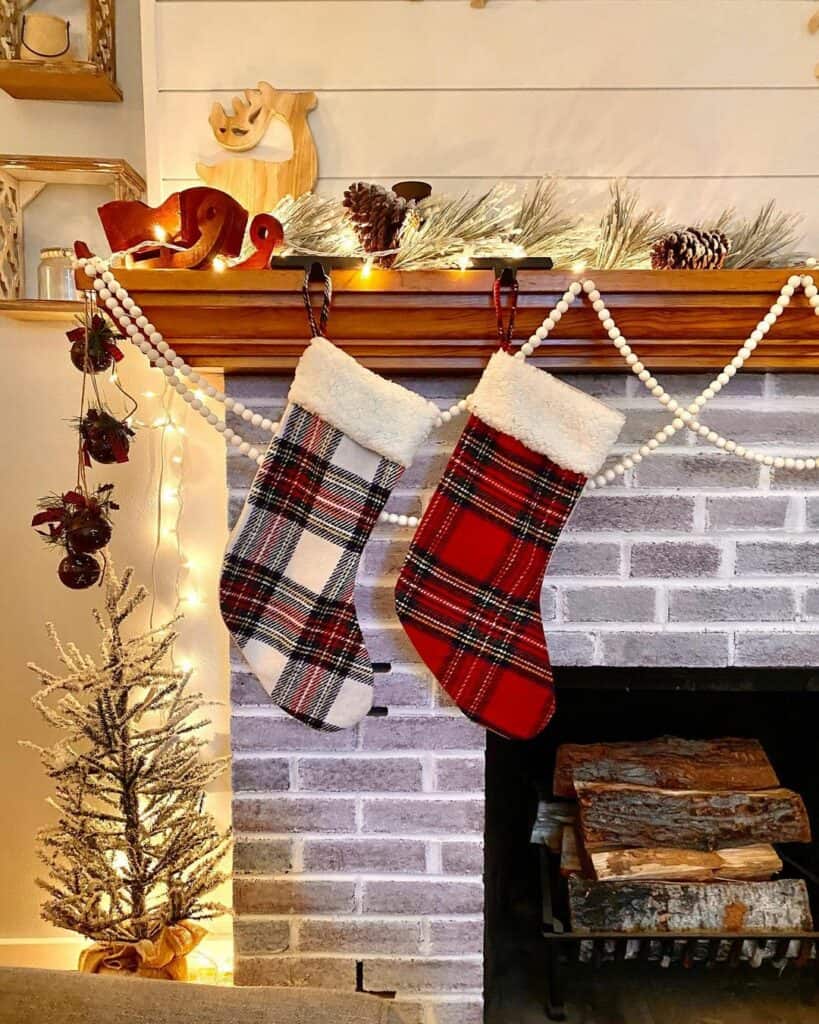 Brick Fireplace With Plaid Christmas Stockings