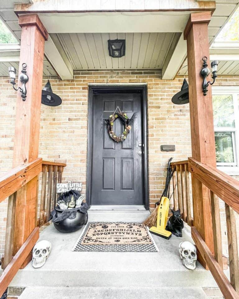 Brick Front Porch With Creepy Halloween Décor