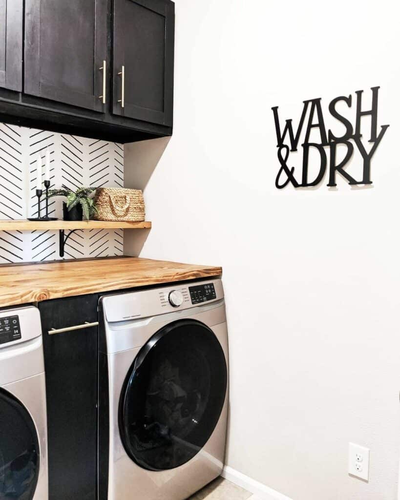 Contrasting Laundry Room With Patterned Wallpaper