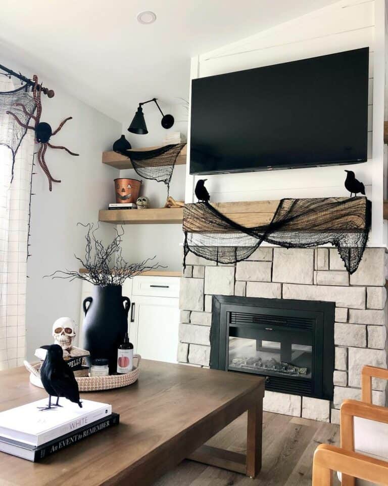 Cozy White Living Room With Black Halloween Décor