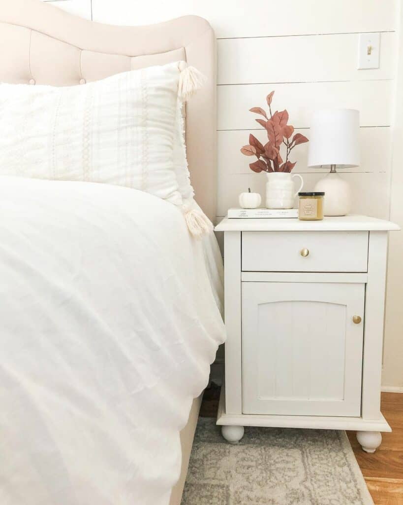 Cream Headboard Leans on White Shiplap