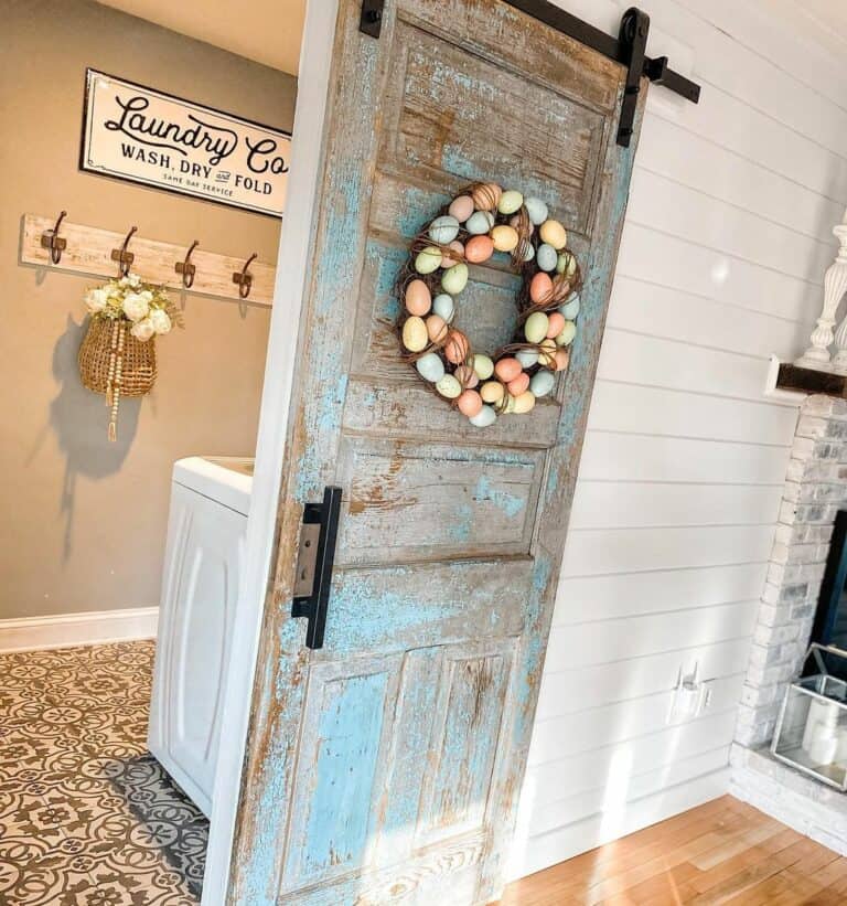 Distressed Door Showcases a Colorful Springtime Wreath
