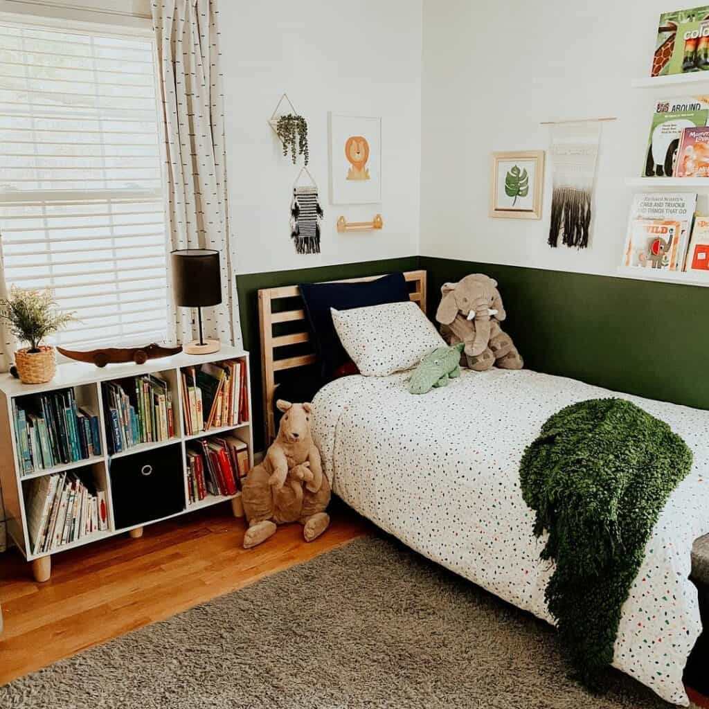 Emerald Green Accent Wall With White Shelves in Boy's Bedroom