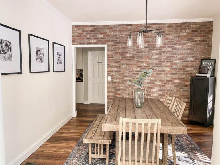 Exposed Brick Accent Wall in Farmhouse Dining Room