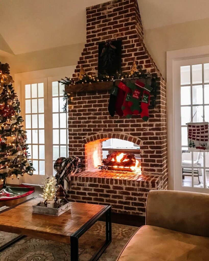 Exposed Brick Fireplace With Christmas Décor