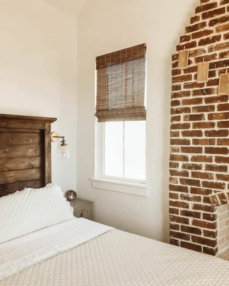 Farmhouse Bedroom With Brick Fireplace