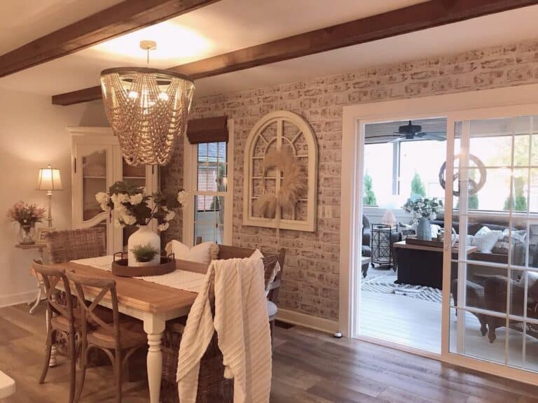 Farmhouse Dining Room With Brick Accent Wall