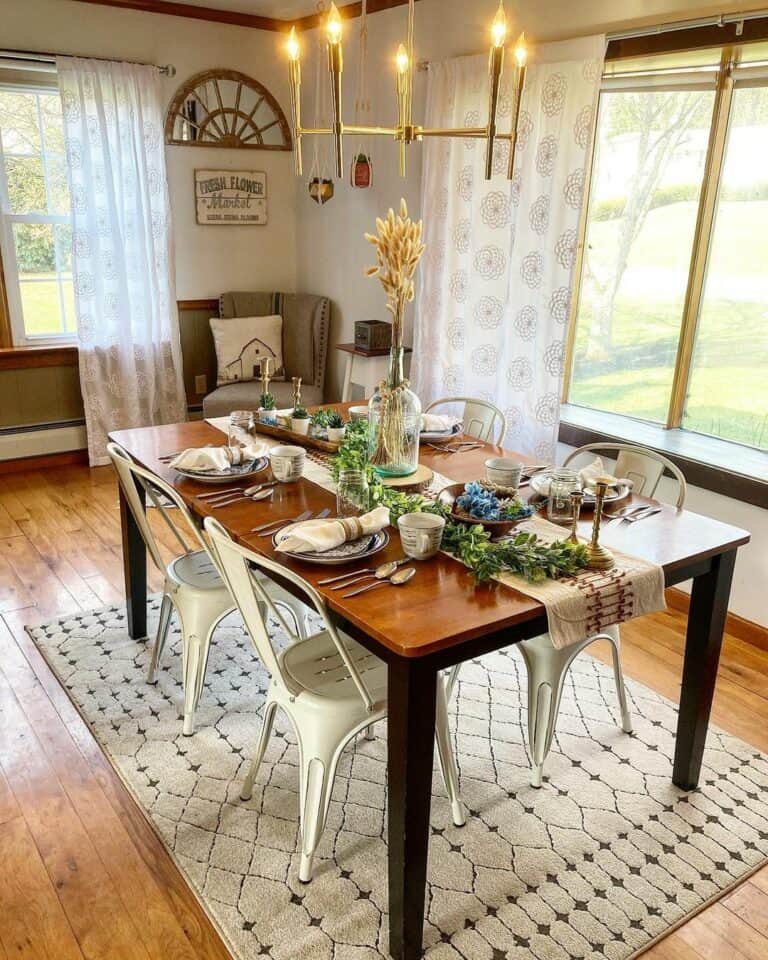 Farmhouse Dining Room With Modern Gold Chandelier