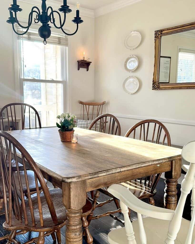 Farmhouse Dining Room With Vintage Chandelier