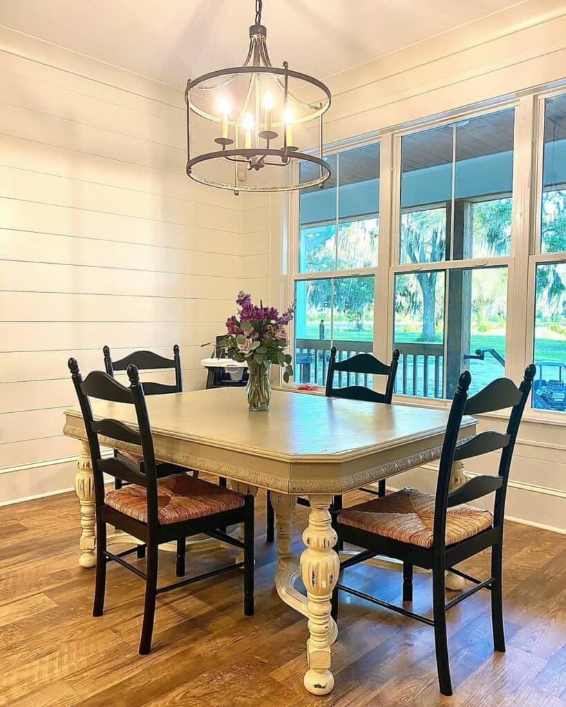 Farmhouse Dining Room With White Shiplap Wall